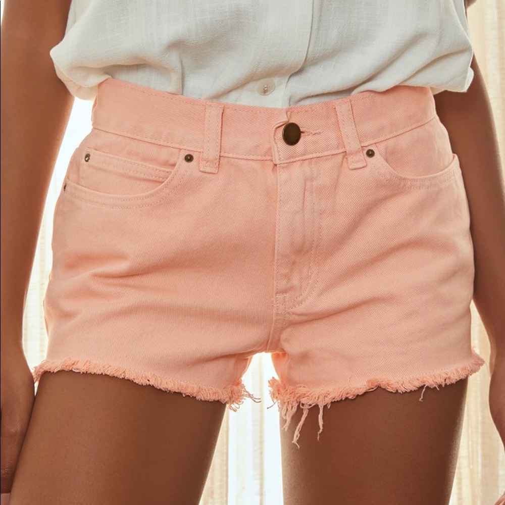 NEVER WORN. PEACH BILLABONG DENIM CUT OFFS - MID RISE.